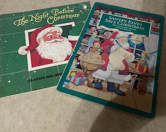 May include: Two children's board books about Christmas. The first book is titled "The Night Before Christmas" and features a classic illustration of Father Christmas. The second book is titled "Santa's Elves Save Christmas" and features a colourful illustration of Father Christmas and his elves.