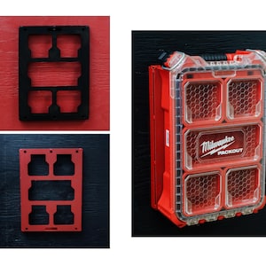 May include: A red and clear plastic Milwaukee Packout organiser case with a honeycomb pattern on the lid, alongside a black rectangular mounting plate and a red rectangular mounting plate, each featuring five cutouts for tool storage.