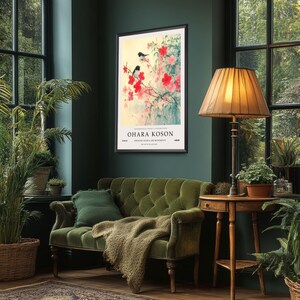May include: A framed print of a Japanese painting featuring two black birds perched on a branch of pink blossoms. The print is titled "Ohara Koson" and is from the "Japanese Woodblock Art Movement".