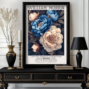 May include: A vintage poster advertising a William Morris Cotton Prints Exhibition in South Kensington, London. The poster features a dark background with a cluster of blue and white peonies.