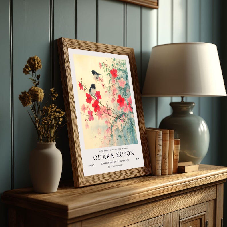 May include: A framed print of a Japanese woodblock print featuring a cherry blossom branch with three birds. The print is titled "Ohara Koson" and is from the "Shin-Hanga Art Movement" in Tokyo.