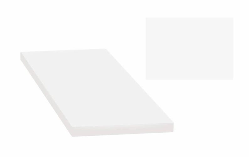 May include: A white rectangular piece of paper with a smooth, flat surface.