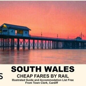 May include: A scenic photograph of Penarth Pier in South Wales at sunset. The pier extends over calm water, with buildings and lights along its length. The sky is a gradient of orange and pink. Text at the bottom reads "SOUTH WALES CHEAP FARES BY RAIL".