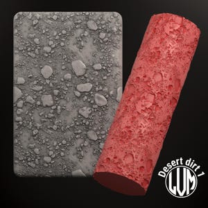 Peut inclure: Un rouleau en silicone texturé de couleur grise et rouge. Le rouleau est conçu pour créer une texture de terre désertique sur une surface. Le texte "Desert dirt 1" est visible sur le rouleau.
