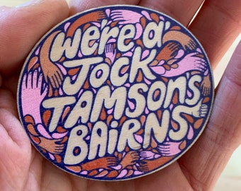 We're a' Jock Tamson's Bairns wooden badge