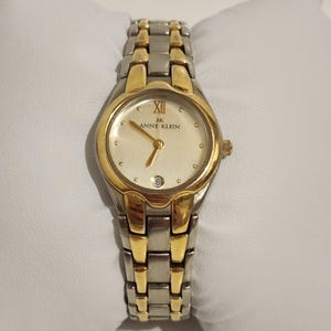 Montre Anne Klein pour femme, date, ronde, bicolore, 24 mm, quartz classique, neuve, pile 6 po