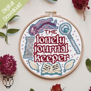 May include: A cross-stitch design in a wooden hoop features the text "The Lonely Journal Keeper" in burgundy. The design includes a purple jellyfish, a magnifying glass, a gray jar, and an open book. The words "Digital Download" are in the upper left corner.