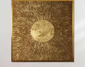 May include: A square gold-toned canvas with a large, circular, textured, gold-toned design in the centre. The design resembles a sun or a star.