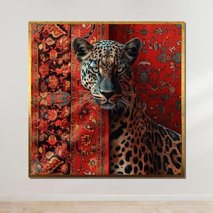May include: A close-up of a leopard's face peering out from behind a red and black patterned rug. The leopard's fur is brown and black with spots. The rug has intricate floral designs.