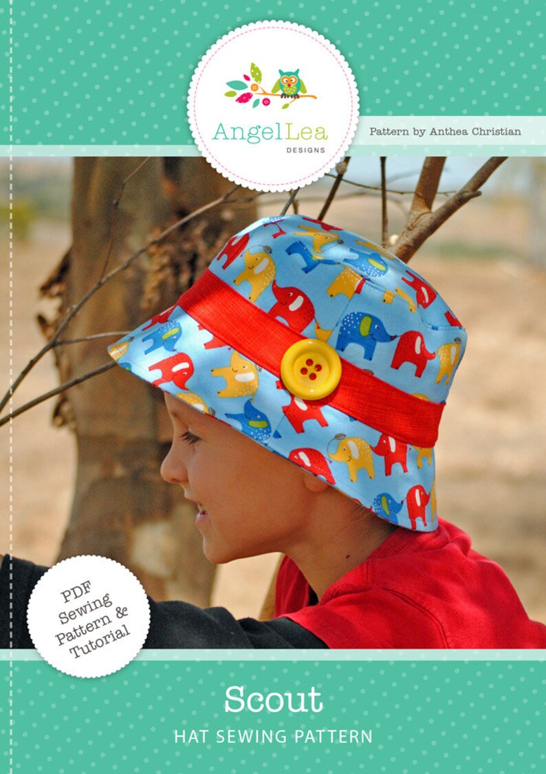 May include: A PDF sewing pattern and tutorial for a blue and yellow hat with an elephant print. The hat is called "Scout" and is designed by AngelLea Designs.