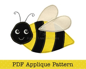 May include: A PDF applique pattern for a cute bee with black and yellow stripes, white wings, and a smiling face. The pattern is for a felt applique project.