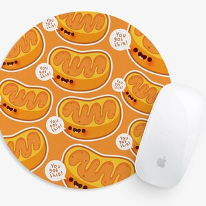 May include: Round orange mouse pad with a repeating pattern of cartoon mitochondria with the text "You got this!" in a speech bubble.
