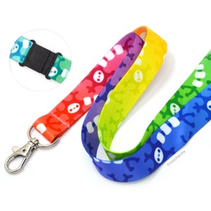 May include: Rainbow lanyard with a white snowman pattern and a silver clip. The lanyard has a black adjustable buckle. &copy;roocharms