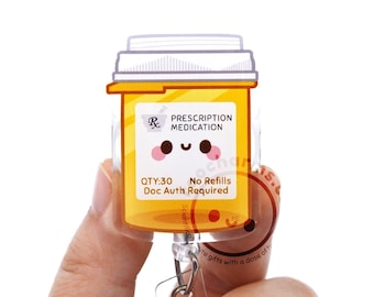 May include: A yellow prescription medication bottle badge reel featuring a white label with the text Rx PRESCRIPTION MEDICATION, QTY:30, No Refills, and Doc Auth Required. The bottle has a cartoon face with black eyes and pink cheeks.