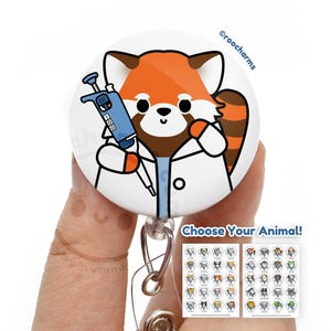 May include: A red panda wearing a white lab coat and holding a blue pipette. The red panda is smiling and has a red and white striped tail. The image is on a white round button with a retractable badge reel. The text "Choose Your Animal!" is below the button. There are two sheets of paper with images of different animals on them.