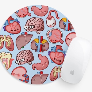 May include: A round mouse pad with a light blue background and a repeating pattern of cartoon human organs with smiling faces. The organs include a brain, heart, lungs, stomach, liver, and kidneys.