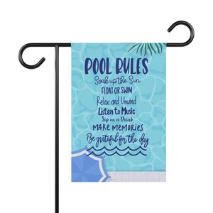 May include: A blue and white garden flag with the text "POOL RULES" and a list of rules for enjoying a pool day. The rules include soaking up the sun, floating or swimming, relaxing and unwinding, listening to music, sipping on a drink, making memories, and being grateful for the day.