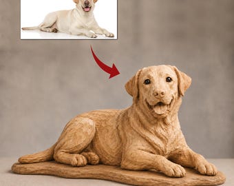 May include: A light brown carved wooden sculpture of a Labrador Retriever dog in a lying position. The dog has a textured surface, dark eyes, and an open mouth. Above the sculpture is a small inset photograph of a yellow Labrador Retriever.