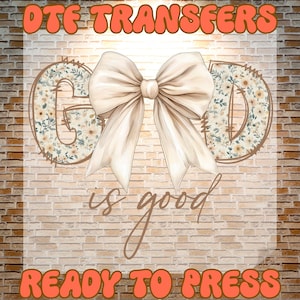 May include: A graphic design featuring the words "DTF TRANSFERS" and "READY TO PRESS" in orange bubble letters. The word "GOD" is spelled out with floral patterns, and a large cream-colored bow is in the center. The phrase "is good" is written in cursive.