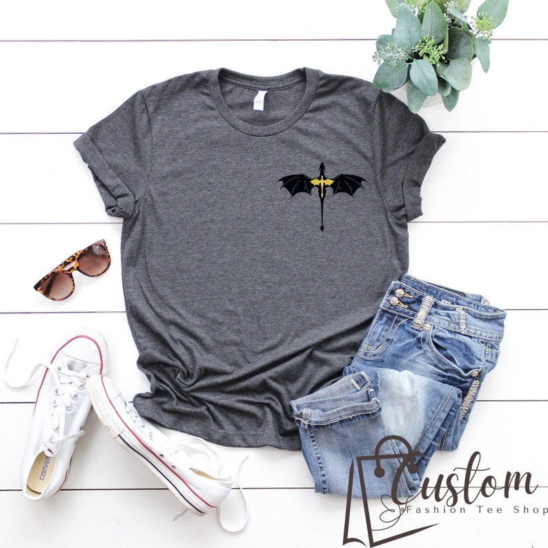 a t - shirt with a bat drawn on it