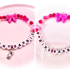 A collage of two pink coquette-style bracelets inspired by Taylor Swift’s The Life of a Showgirl track “Actually Romantic.” One reads “Tacky,” and the other “Boring Barbie,” referencing the lyrics “I heard you called me Boring Barbie” and “You think I’m tacky, baby? Stop talking dirty to me.” These bracelets capture the song’s playful defiance and rumored connection to Charli XCX’s Brat “Sympathy Is a Knife.” Perfect for Swifties who love Taylor’s clever, feminine, and subtly savage storytelling