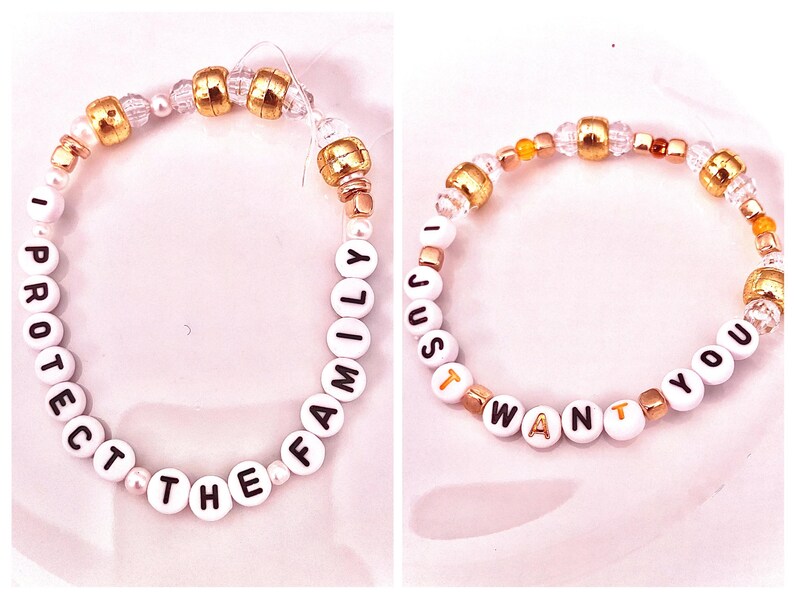 A bold gold beaded bracelet inspired by Taylor Swift’s provocative track “Father Figure” from The Life of a Showgirl. Featuring the phrase “I protect the family,” it embodies the song’s fierce, confident energy and power. The design echoes the lyric “My check’s bigger,” symbolizing strength, dominance, and independence. Perfect for Swifties who love Taylor’s fearless storytelling and unapologetic edge, this bracelet is a dazzling tribute to her boldest and most empowering Showgirl era.
