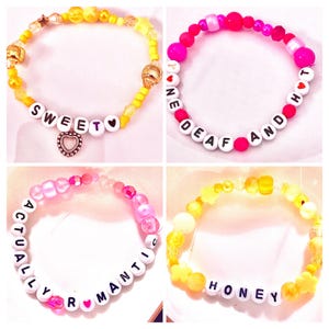 Celebrate the golden charm of Taylor Swift’s The Showgirl era with this yellow beaded “Sweet❤️” bracelet, inspired by her song “Honey” and the heartfelt line, “When anyone called me sweetheart.” Featuring a delicate heart charm, this bracelet captures the warmth, vulnerability, and vintage elegance of the lyric’s nostalgic tone. Perfect for Swifties who adore Taylor’s soft, romantic storytelling, this bracelet adds a meaningful, feminine touch to any outfit or bracelet stack.