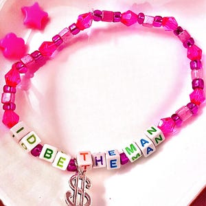 Inspired by Taylor Swift's empowering anthem "The Man," features a dollar sign charm. For Swifties, this accessory symbolizes strength and independence, capturing the bold spirit of Lover era. Great costume for eras tour to match the man jackets