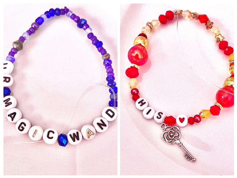 featuring three Taylor Swift–inspired bracelets from The Life of a Showgirl: “ur magic wand,” “his ❤️” with a key charm, and “it sounds cocky.” Inspired by her sultry song “Wood,” rumored to reference Kansas City Chiefs’ Travis Kelce, these bracelets capture the lyrics “Redwood tree, it ain’t hard to see his love was the key that opened my skies” and “The spell was broken by your magic wand.” A perfect tribute to Taylor’s romantic rebirth and enchanting storytelling in her Showgirl era.