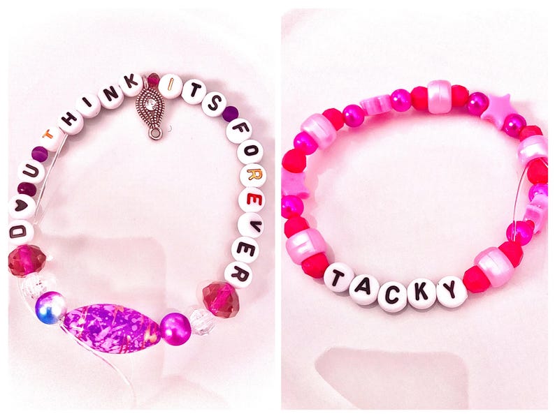 A stunning purple beaded bracelet inspired by Taylor Swift’s The Life of a Showgirl era, featuring the lyric “Do you think it’s forever” from her song “Elizabeth Taylor.” The deep violet tones and elegant design capture the emotion of the line “I’d cry my eyes violet,” symbolizing timeless love and heartbreak. Perfect for Swifties who adore Taylor’s cinematic storytelling and want a meaningful accessory that reflects the song’s hauntingly beautiful and glamorous essence.