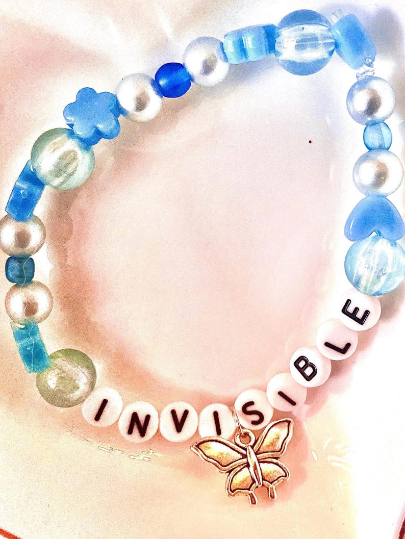 Celebrate the emotional depth of Taylor Swift’s debut album with this blue beaded bracelet, inspired by teardrops on My Guitar." Featuring a guitar charm, this bracelet is a perfect tribute to the song’s themes of heartbreak and unspoken love