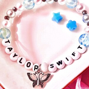 Celebrate the essence of Taylor Swift’s debut album with this bracelet. Featuring a music butterfly charm, this bracelet symbolizes both transformation and creativity, making it a perfect tribute for Swifties who cherish her early music.