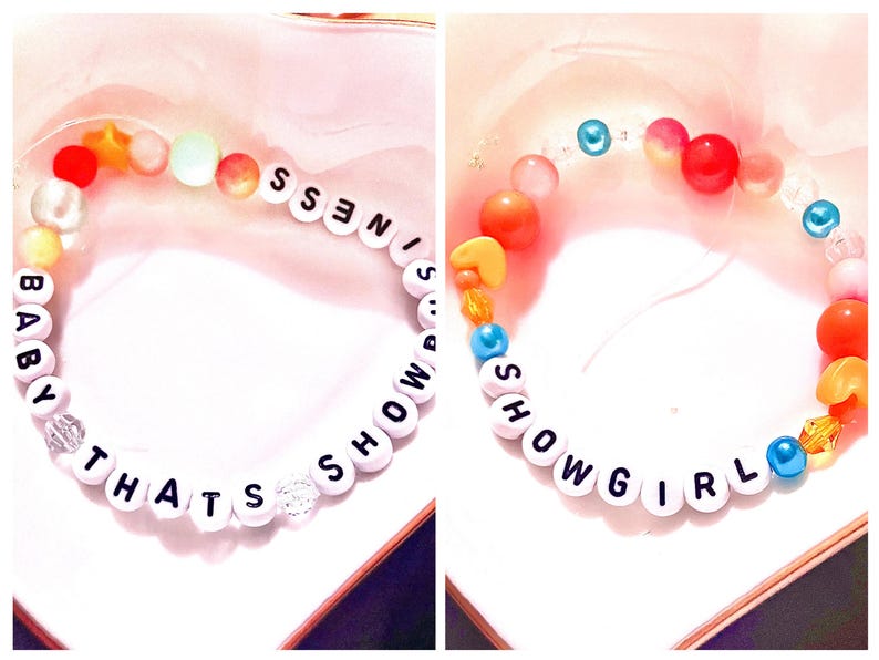 A collage showcasing two handmade Taylor Swift The Life of a Showgirl inspired friendship bracelets. One bracelet features the phrase “Baby That’s Showbusiness”, while the other spells “Showgirl.” Both designs are crafted with bold orange and teal beads, strung on durable elastic with letter beads. Perfect Swiftie jewelry for concerts, gifts, or stacking, these bracelets capture the playful glamour of Taylor’s newest album era and make trendy collectible fan accessories