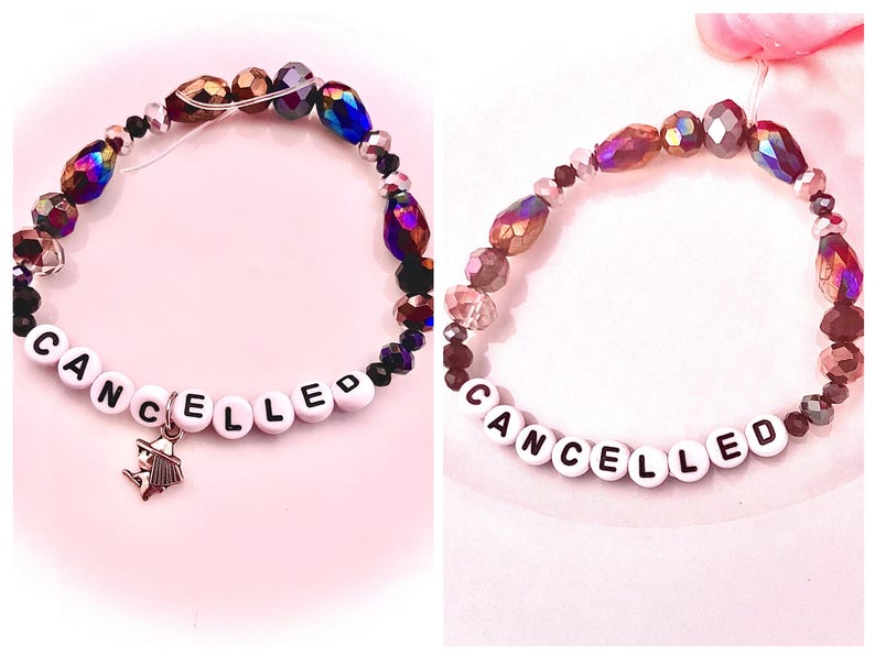 two Taylor Swift–inspired bracelets from The Life of a Showgirl: one reading “Tone Deaf and Hot” and the other “Cancelled.” Inspired by her track five, “Cancelled,” rumored to be about Blake Lively, the bracelets reflect the song’s edgy lyrics “Good thing I like my friends cancelled” and “Tone deaf and hot, let’s f*cking off her.” A perfect tribute to Taylor’s fierce wit, self-awareness, and pop culture commentary, these bracelets embody the drama and confidence of her Showgirl era.