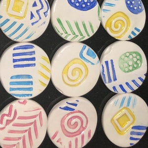 Eight Glazed ceramic paper weights