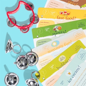 May include: A set of colorful icebreaker cards with different topics, including pets, fast food, sports, summer fun, hobbies, and ice cream. The cards feature a question mark and the text "topic is..." on each card. The cards are arranged in a stack, with the top card showing the topic "pets".