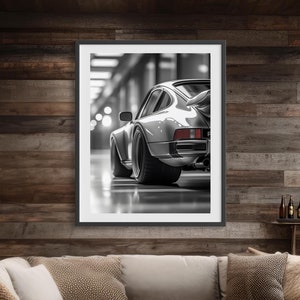 May include: A living room with a large sectional sofa, a coffee table, a pool table, and a framed black and white photograph of a classic car. The walls are wood panelled and the floor is hardwood.