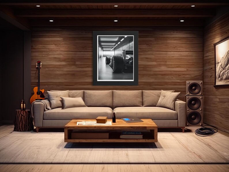 Captivating black and white Formula 1 car photograph showcasing sleek tires and chassis in a modern garage. Great gift for racing fans, adding masculine decor and dynamic energy to any space, including man caves. f1 wall art, f1 poster