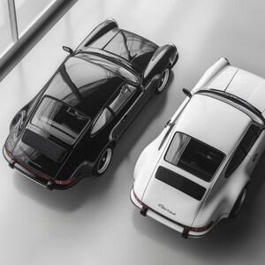 Two iconic Porsche 911s from a top-down view, high-quality art print brings sophistication and style to any room. Ideal for car lovers, this piece makes a unique addition to man caves, garages, or office decor, celebrating classic automotive design.