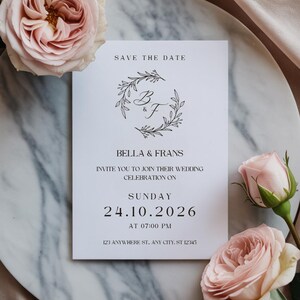 Elegant Wedding Save The Date – Monogram & Floral Wreath | Canva Template