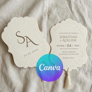 Puede incluir: Dos invitaciones de boda marfil con diseños de bordes florales y borlas. Una muestra las iniciales "SA" y la fecha "23.04.2023". La otra dice "Estás invitado a la boda de SEBASTIAN & ADELINE" y detalles del evento.