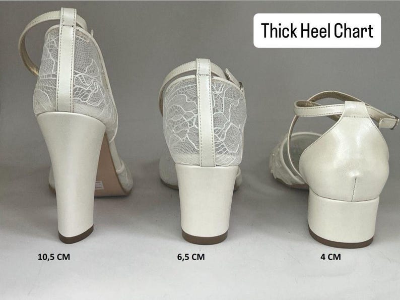 May include: Three pairs of ivory-colored bridal shoes with thick heels are displayed. The heels measure 4 cm, 6.5 cm, and 10.5 cm. The shoes feature a delicate lace overlay on the upper and ankle straps. The text "Thick Heel Chart" is at the top.