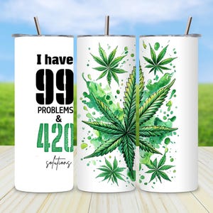 May include: White stainless steel tumbler with a green marijuana leaf design and the text "I have 99 problems & 420 solutions".