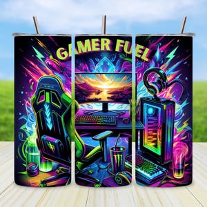 May include: A set of three stainless steel tumblers with a gamer theme. The tumblers feature a colorful design with a gaming chair, a computer, and a headset. The text "Gamer Fuel" is printed on the tumblers.