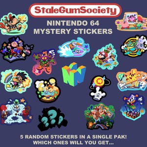 May include: A collection of colorful Nintendo 64 mystery stickers. The stickers feature various cartoon characters and designs, with the text "StaleGumSociety" and "Nintendo 64 Mystery Stickers" at the top. The text "5 random stickers in a single pak! Which ones will you get..." is at the bottom.