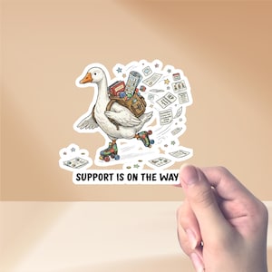 May include: A sticker depicting a cartoon goose on roller skates, carrying a backpack filled with school supplies and documents. The goose is white with an orange beak and is surrounded by stars and papers. The text "SUPPORT IS ON THE WAY" is at the bottom.