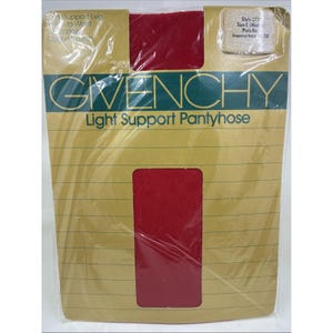 May include: Sealed package of Givenchy Light Support Pantyhose. The packaging is tan with a red window showing the pantyhose. The Givenchy logo and product information are printed on the front. The pantyhose are a solid red colour.