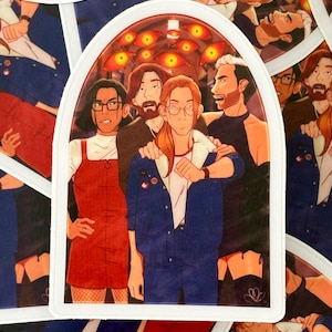 May include: A sticker featuring a group of five people in a dark room with glowing red eyes in the background. The people are wearing a variety of clothing, including a red dress, a blue jacket, and a black dress. The sticker is printed on white paper and has a rounded arch shape.