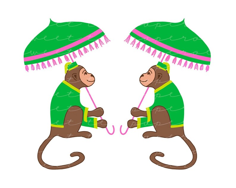 May include: Two monkeys wearing green and gold outfits hold pink umbrellas with green and pink tassels. The monkeys are facing each other.