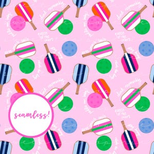 May include: A seamless pattern featuring pink, green, blue, and orange paddleball rackets and balls on a pink background. The pattern includes the text "dink responsibly", "queen of the court", "serve smash smile", "relish the day", "me, baby!" and "briny".